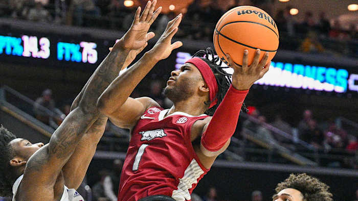 Razorbacks Ricky Council IV puts up a shot inside against Kansas on Saturday at NCAA Tournament.